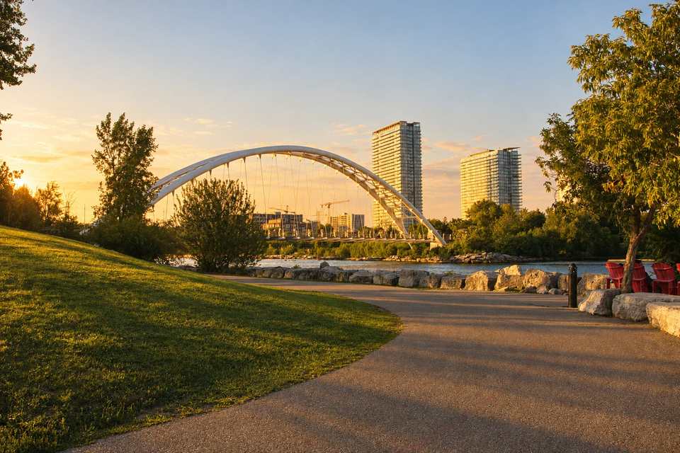 The Humber Bay Arch Bridge and lakeshore condo towers seen from Humber Bay Park East, Etobicoke, at golden hour