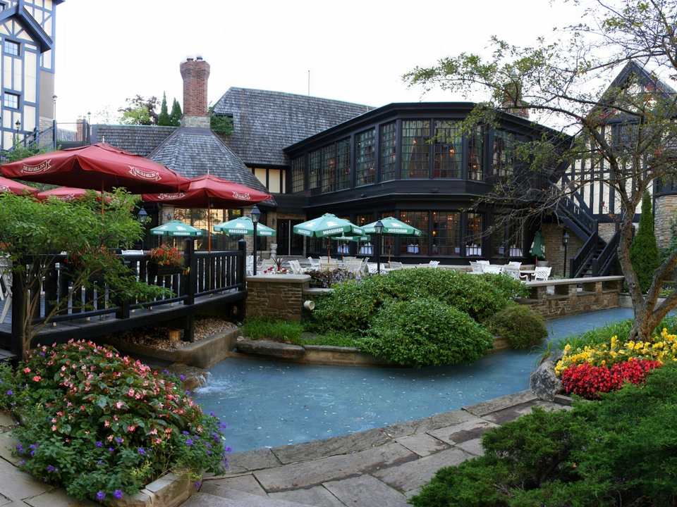 Gardens and Tudor-style buildings of the Old Mill Inn by the Humber River, beside The Kingsway in Etobicoke